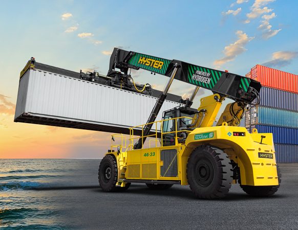 Hyster electric container handler lifts a container at sunset